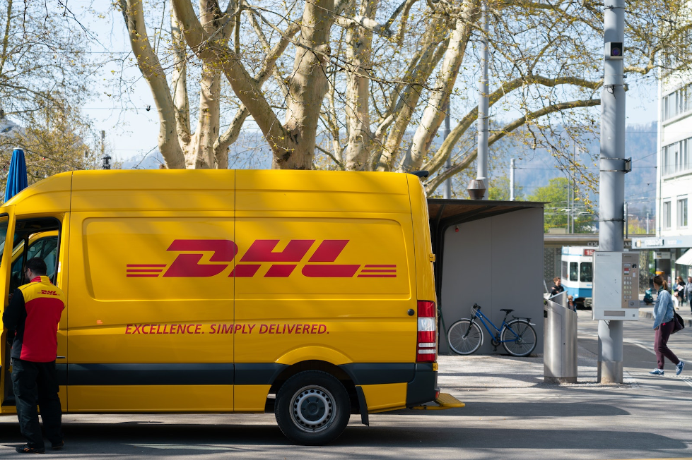 DHL delivery truck parked on a road